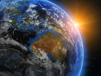 australia on globe with sunrise